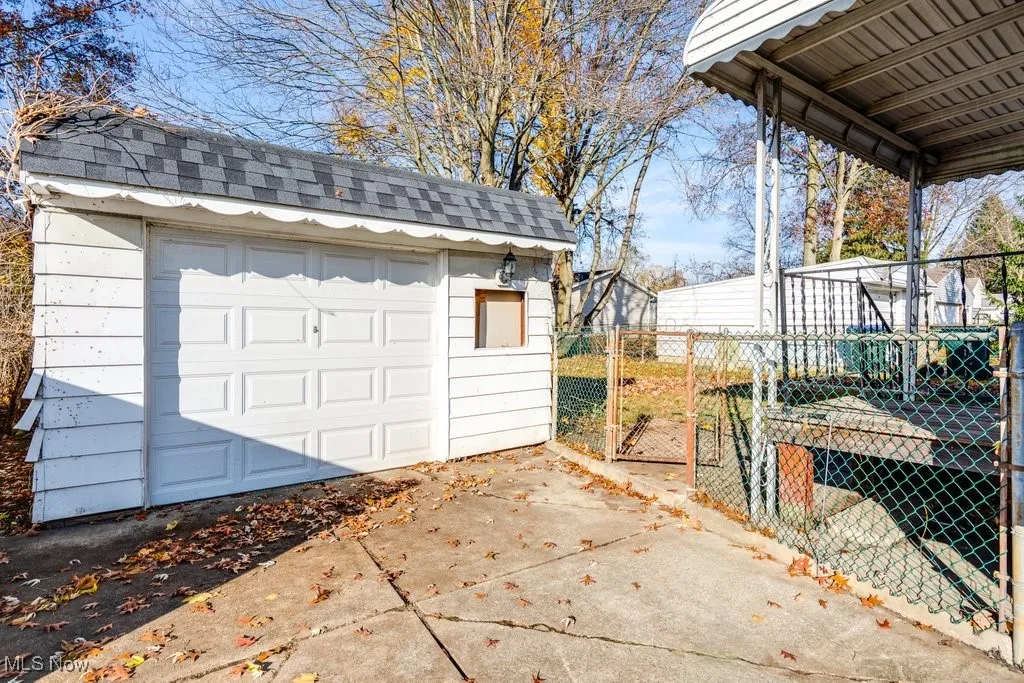 Garage, covered back patio, gate to fenced in backyard