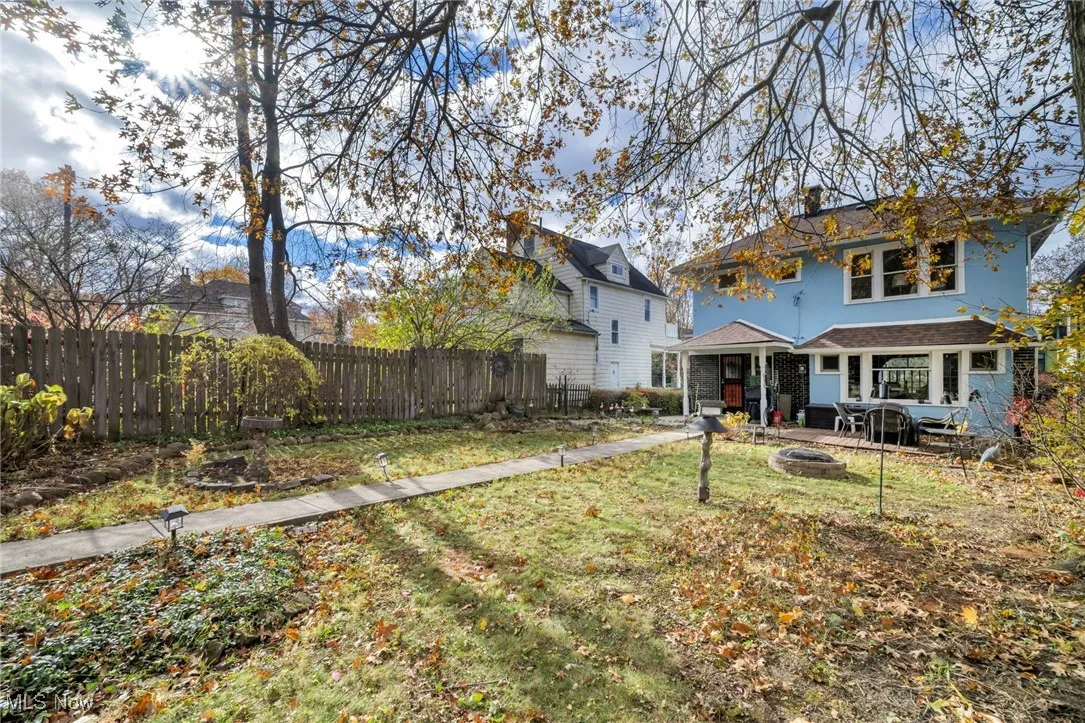 Rear view of house featuring a fire pit