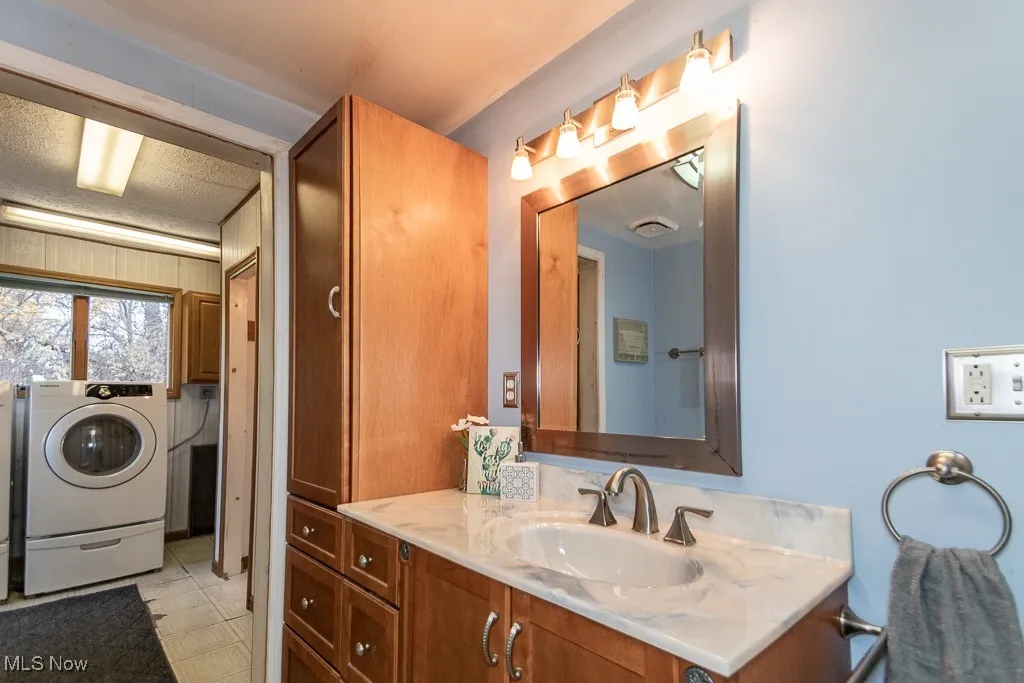 Rear main-level laundry accessible from bathroom or rear entrance