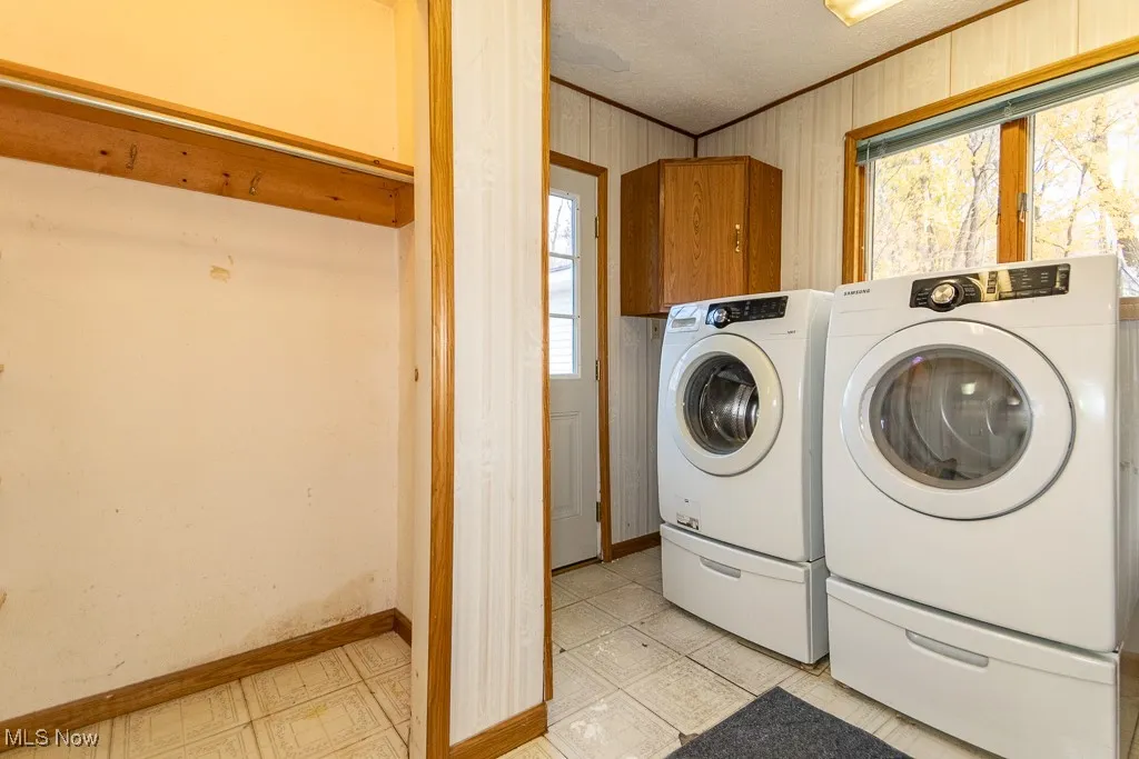 Closet space and rear entrance to laundry room