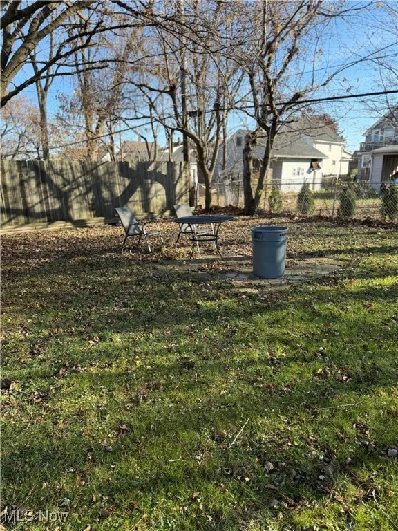 Fenced backyard featuring a patio