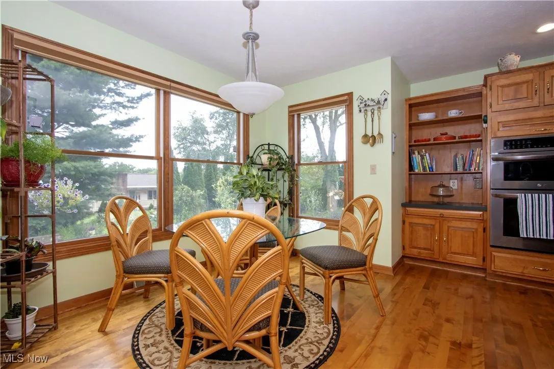 Dining room featuring light wood-type flooring and baseboards