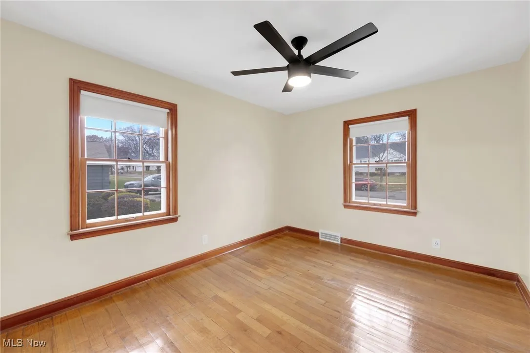 Unfurnished room with plenty of natural light and light wood finished floors