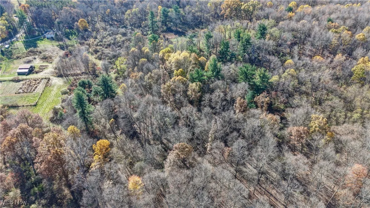 Aerial view of property and surrounding area with rural landscape