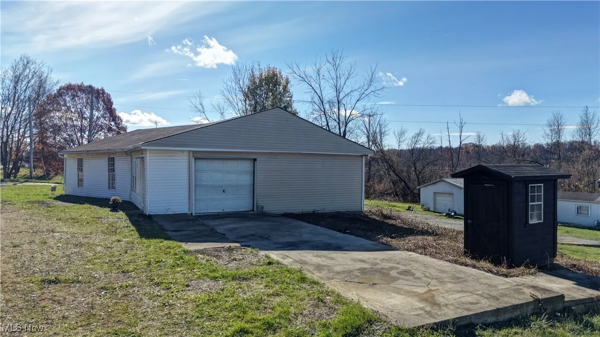 Detached garage with driveway