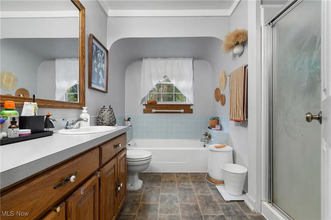 Bedroom with new skylights, light carpet, and lofted ceiling