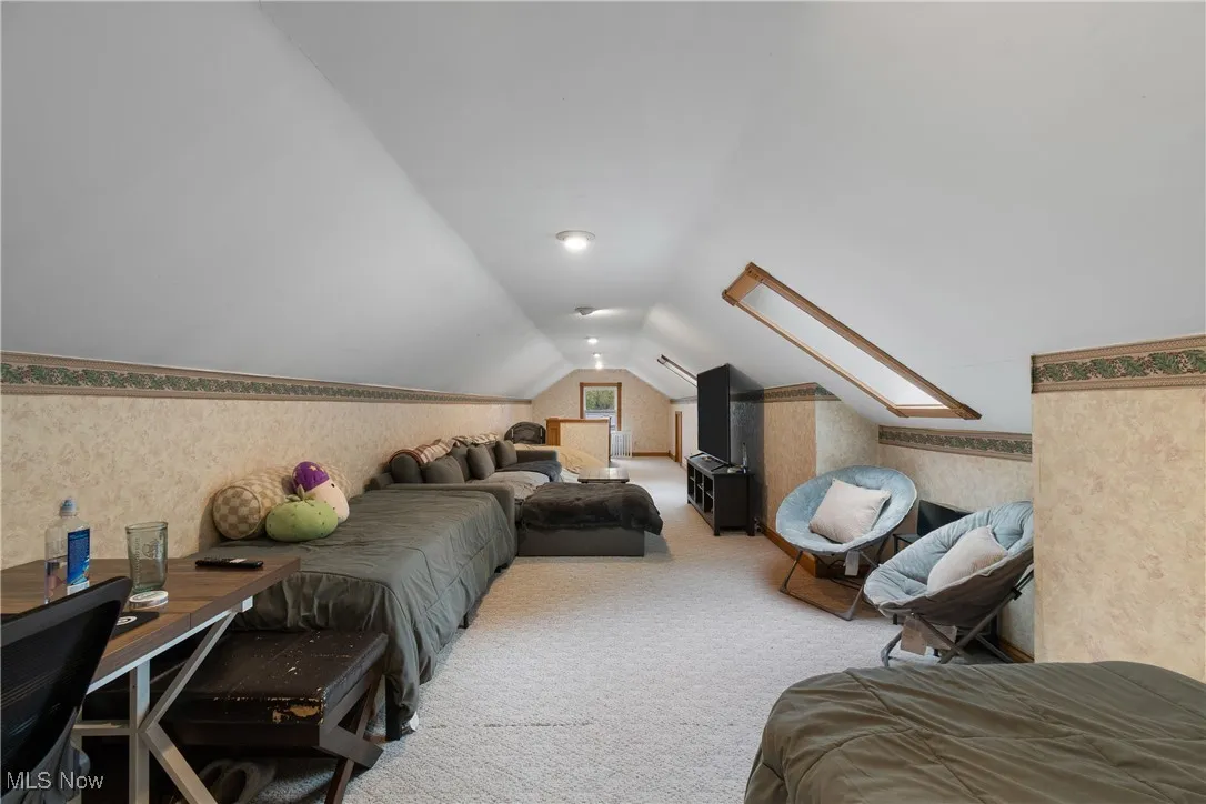 Bedroom featuring access to exterior, light hardwood finished floors, and ceiling fan
