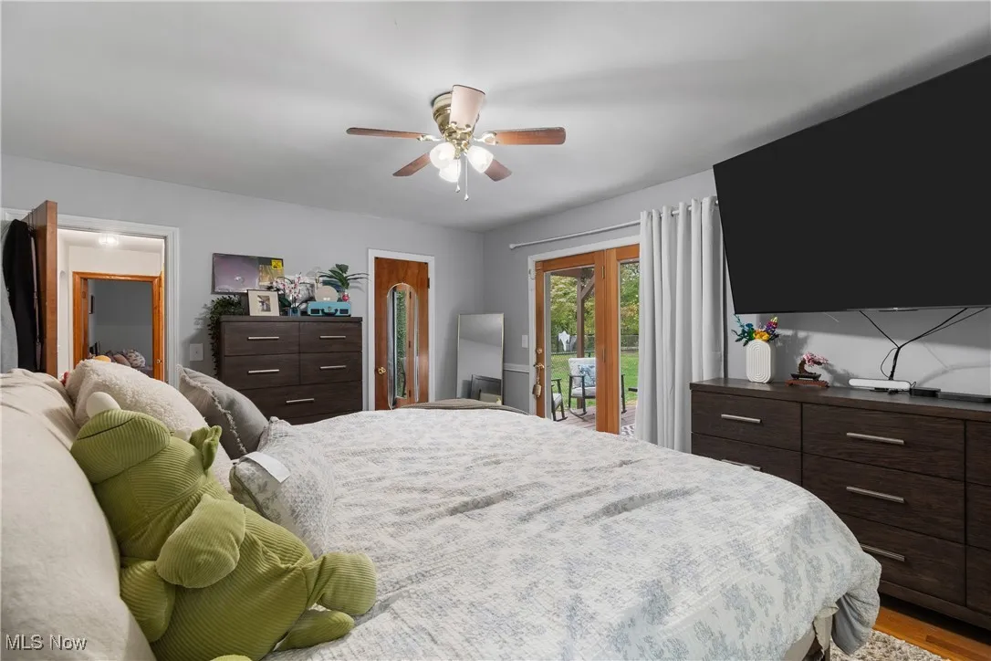 Bedroom with a new skylight, vaulted ceiling, and carpet floors