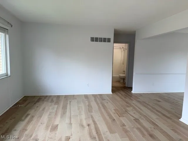 Unfurnished room with light wood-style floors