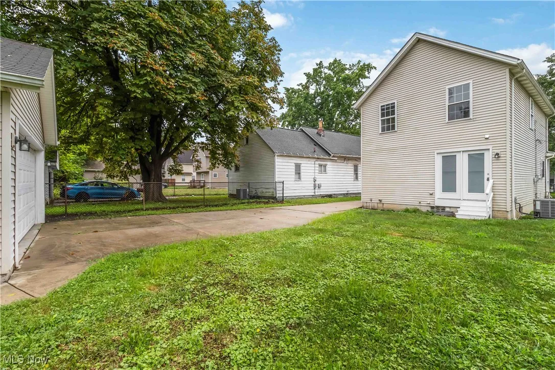 Rear view of house with entry steps
