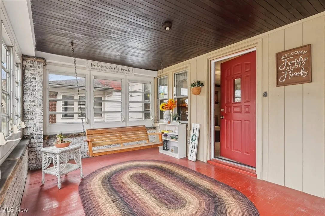 Sunroom with wooden ceiling
