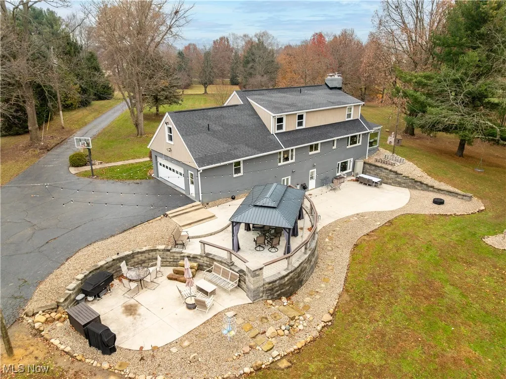 Aerial view of the patios, driveway and attached garage.