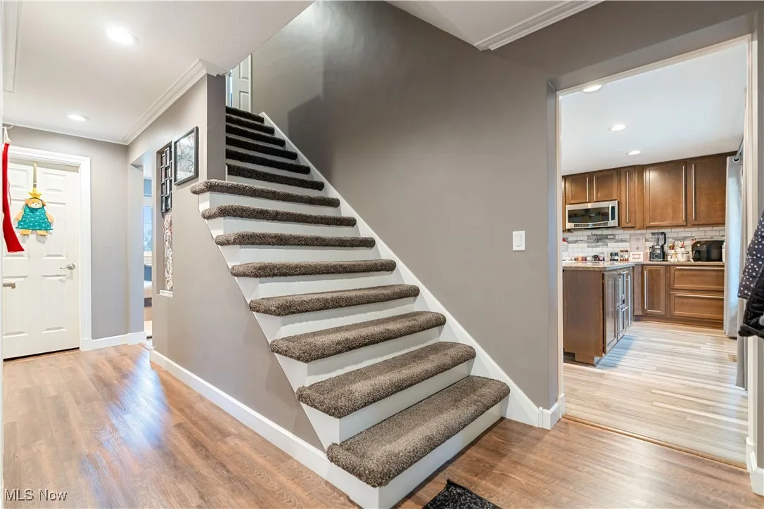 Foyer entry with lovely flooring and neutral colors.