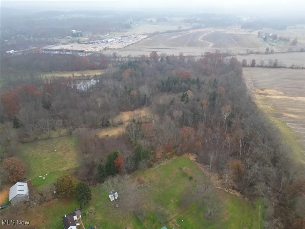 Aerial view of property and surrounding area with rural landscape