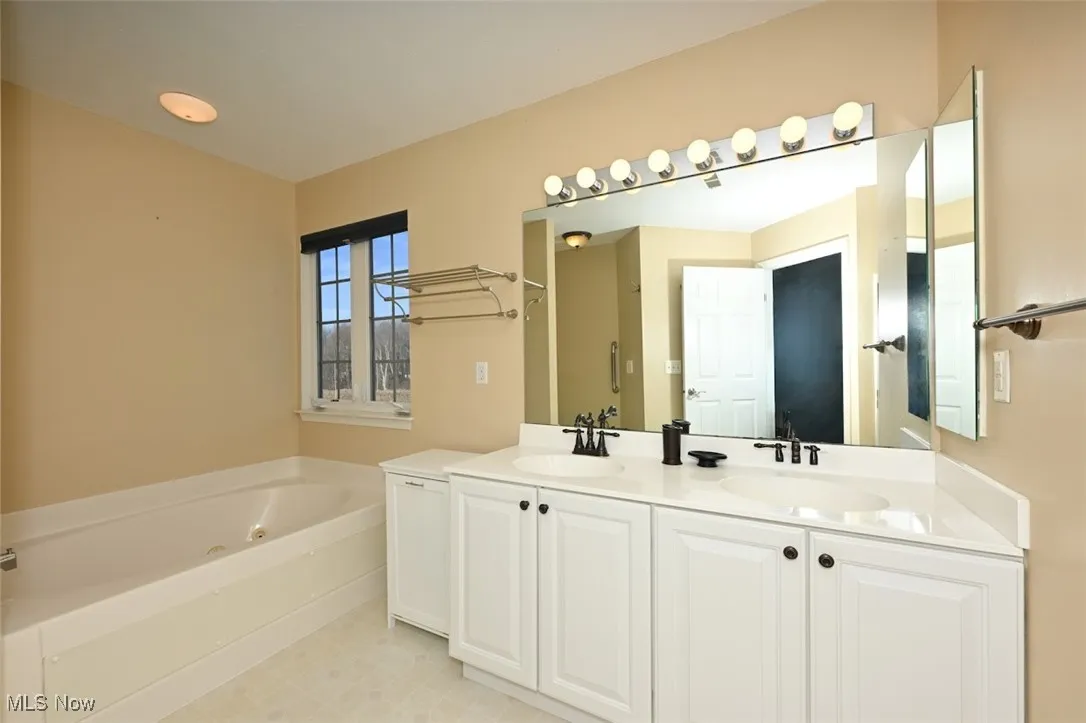 Ensuite Bathroom with double vanity, and jetted tub.