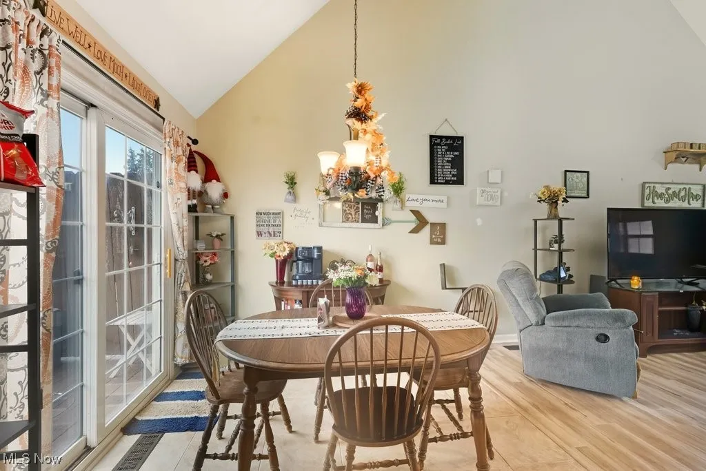 DINING AREA VIEW 2. SLIDING GLASS DOORS TO BACK DECK.