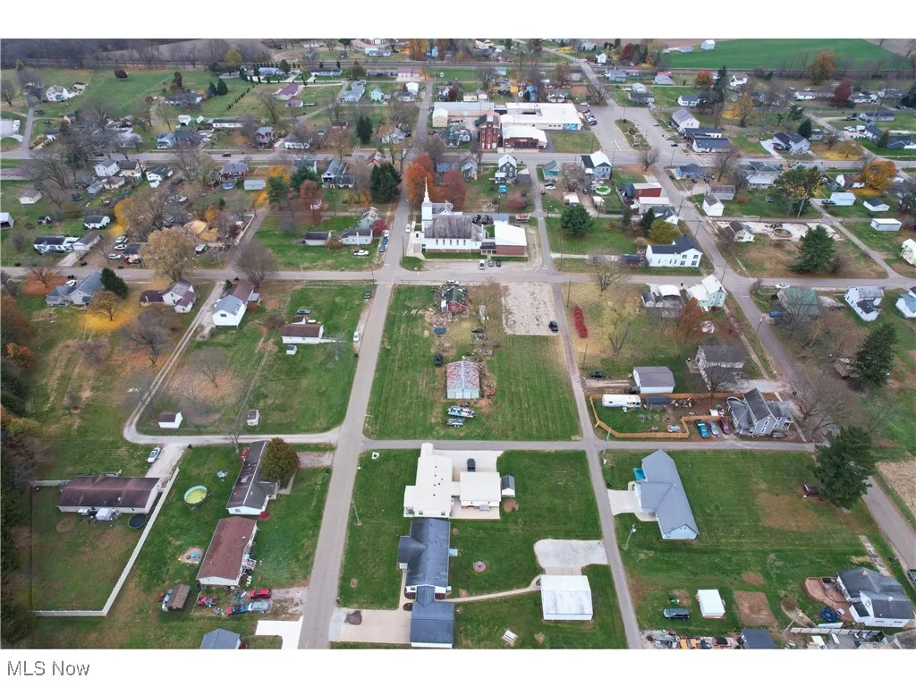 View of property location with nearby suburban area