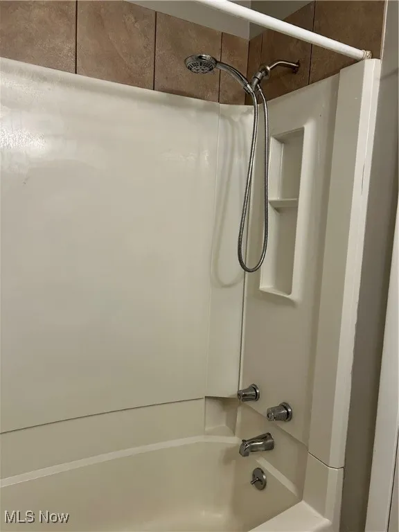 Bathroom featuring  shower combination