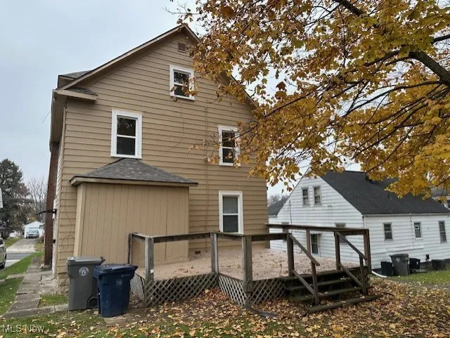 Back of house with a wooden deck