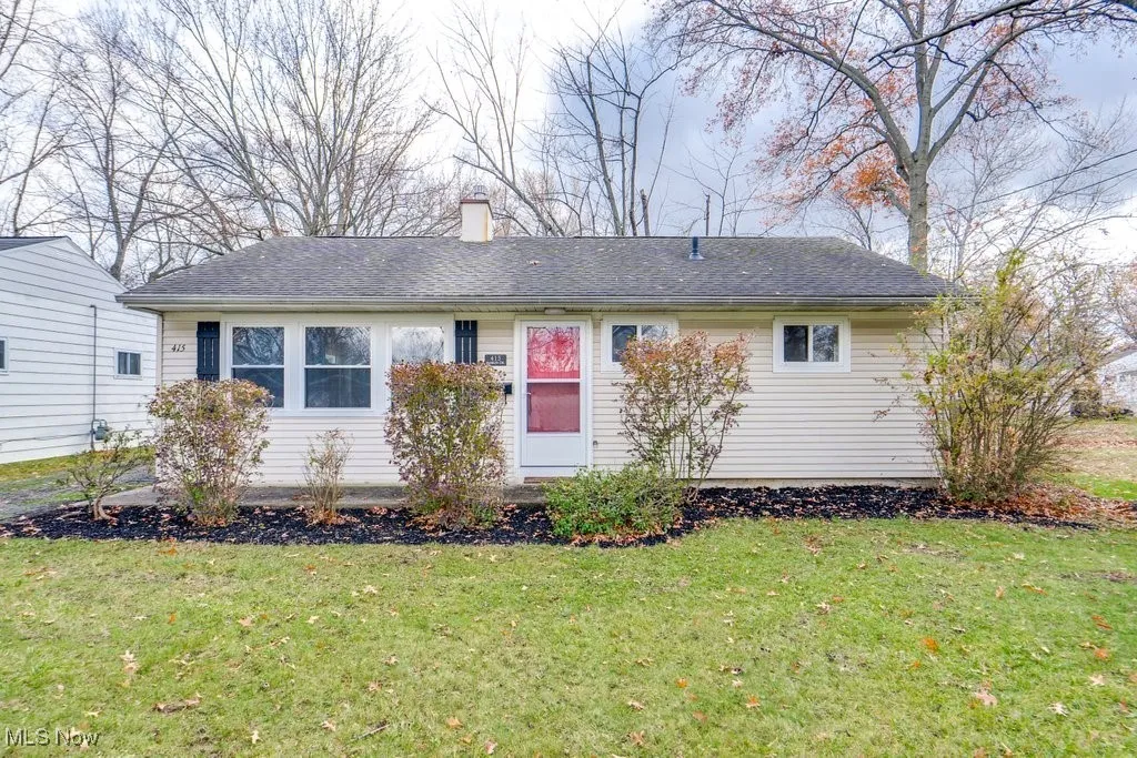 Single story home with a front yard, a chimney, and roof with shingles