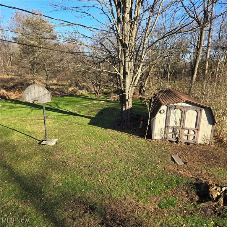 LARGE SHED IN BACKYARD. LOT NEAR COMMUNITY PARK.