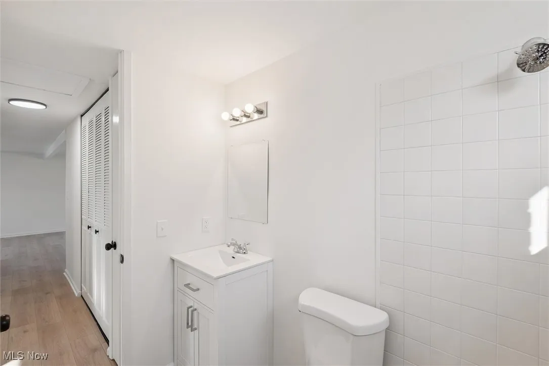 Bathroom with vanity and light wood-style floors