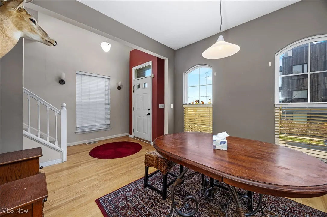 Entrance foyer featuring stairs and light wood-style flooring