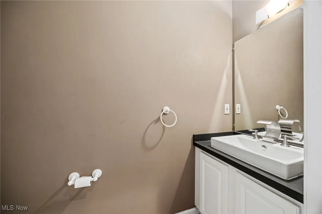 Half bathroom featuring vanity