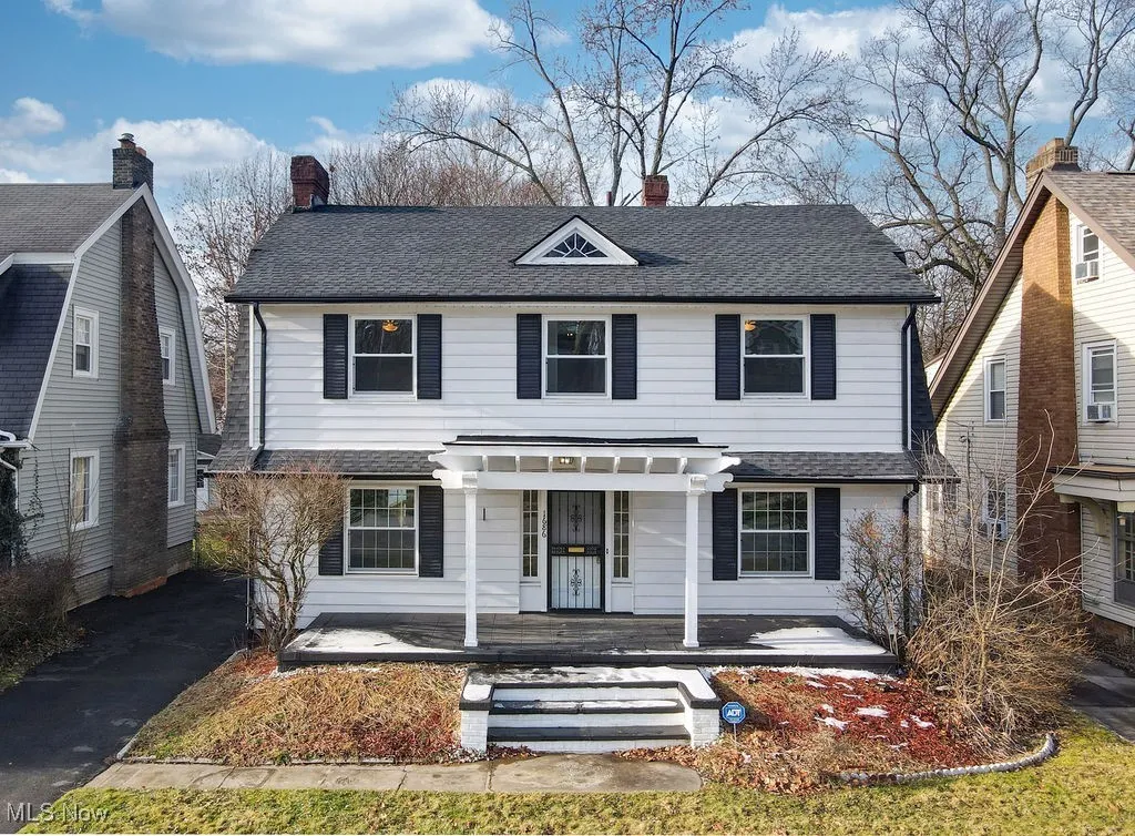 View of front of house featuring a shingled roof, porch and pergola over front entrance.