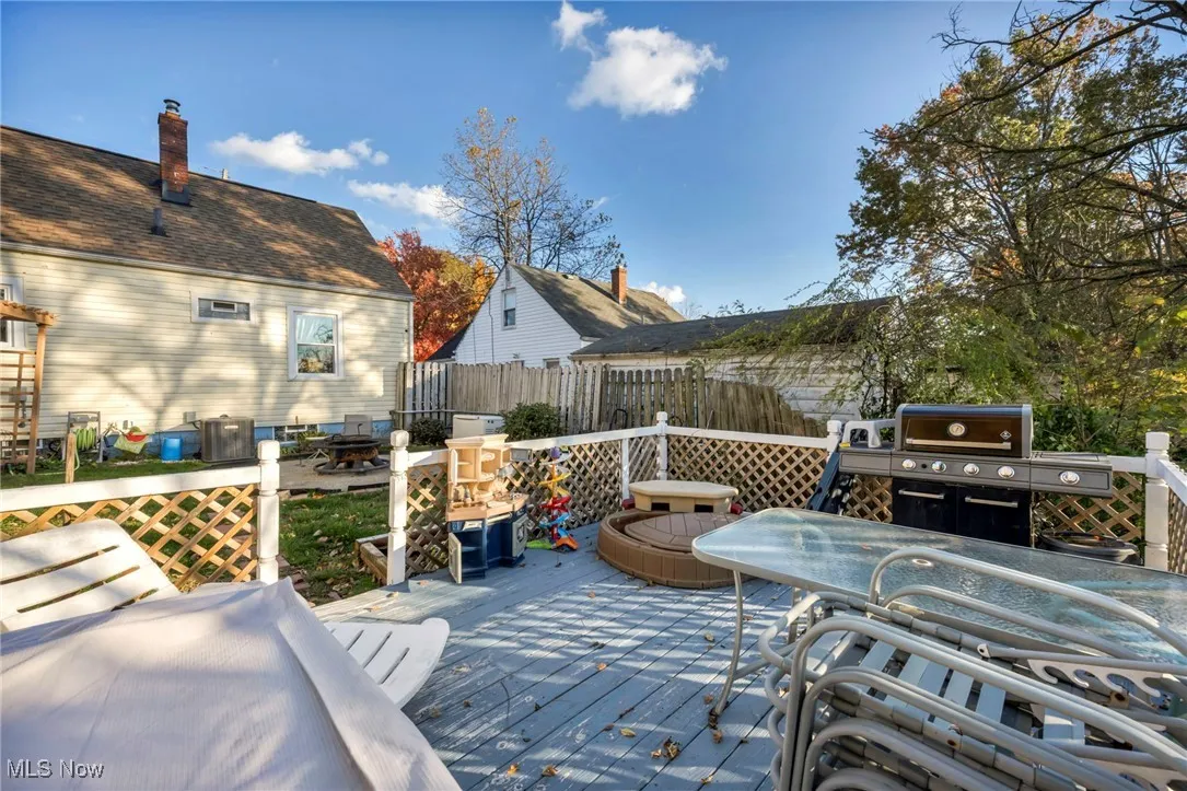 Wooden terrace featuring outdoor dining area
