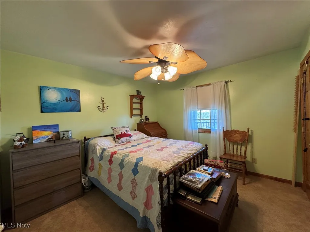 Bedroom featuring carpet floors and a ceiling fan