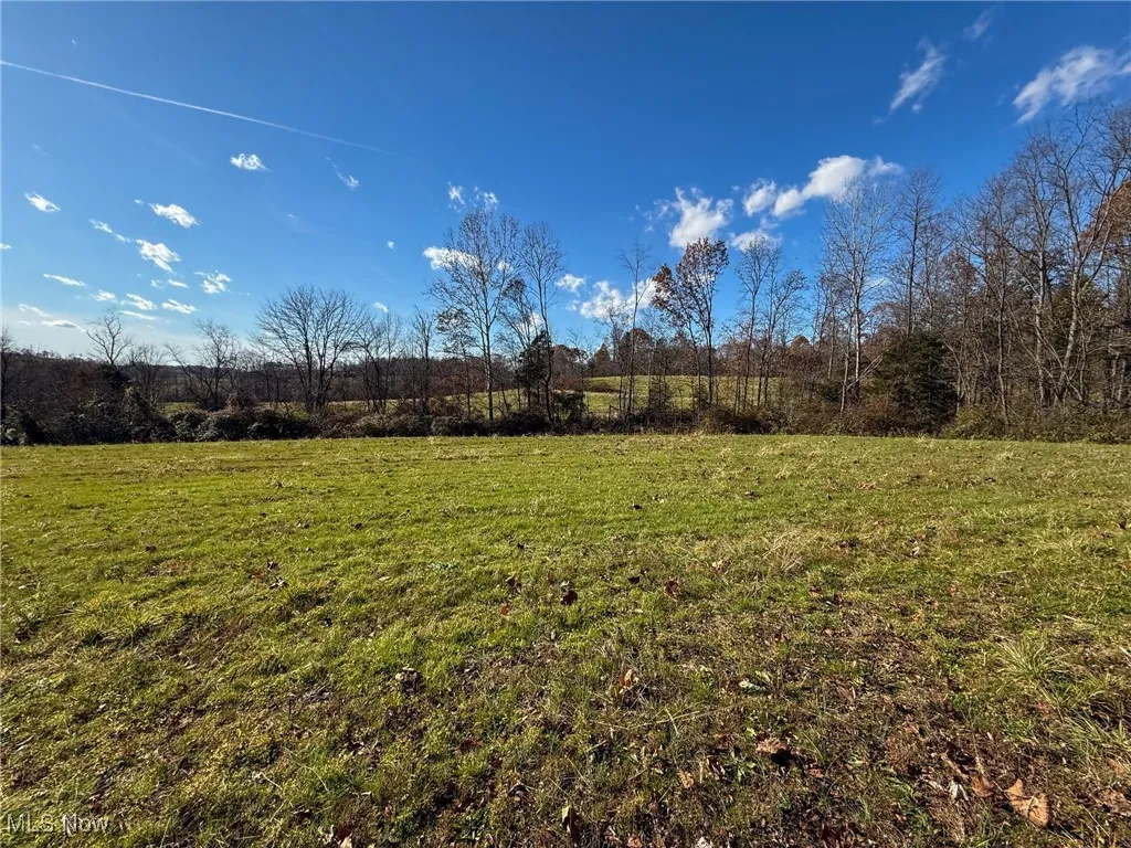 View of green lawn featuring a view of countryside