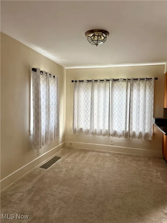 View of carpeted dining room