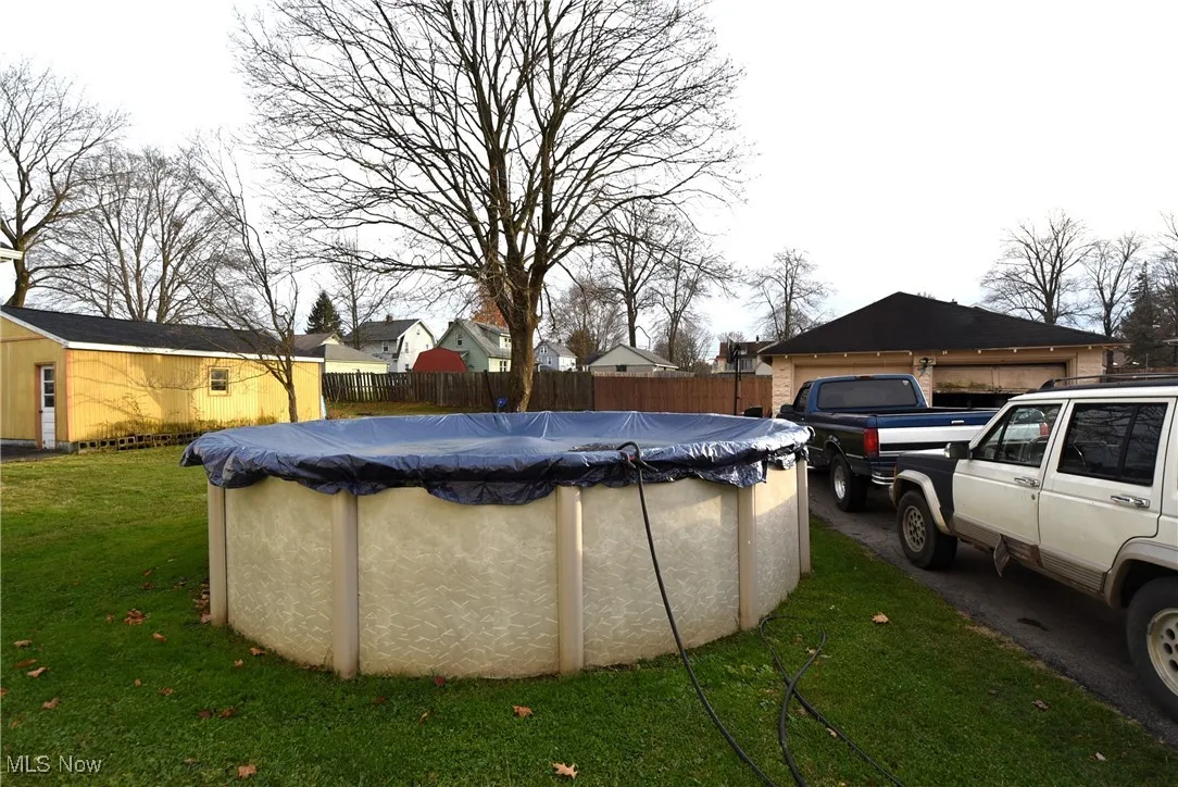View of swimming pool with an outbuilding