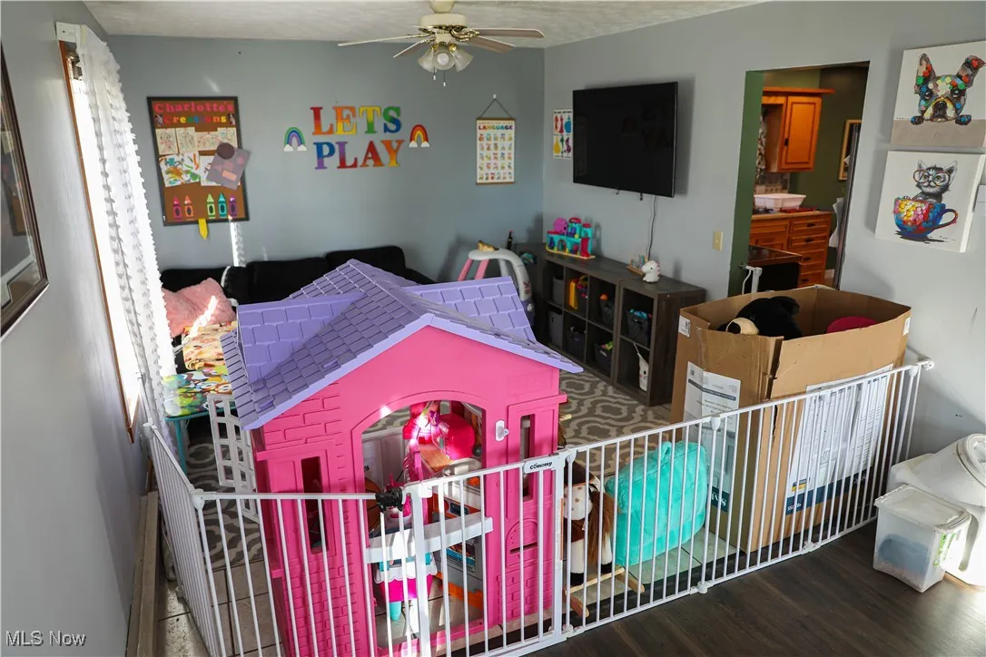 Bedroom featuring a ceiling fan and wood finished floors