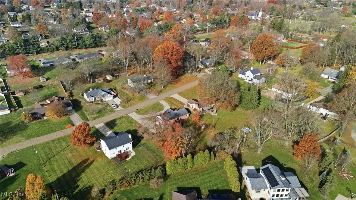 Aerial view of property's location featuring nearby suburban area