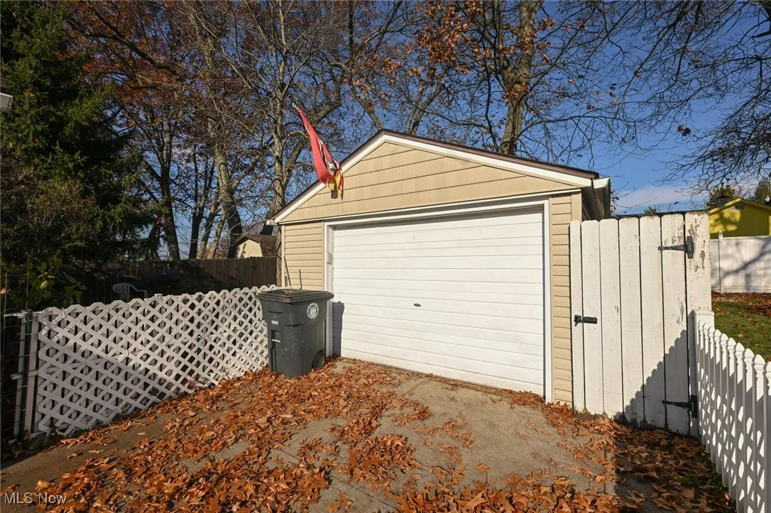 Detached garage with a gate