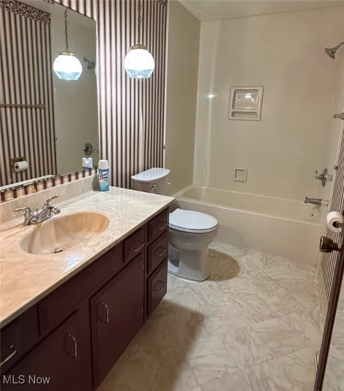 Full bathroom with vanity and shower / tub combination