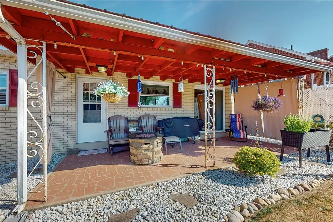 View of patio / terrace with a fire pit
