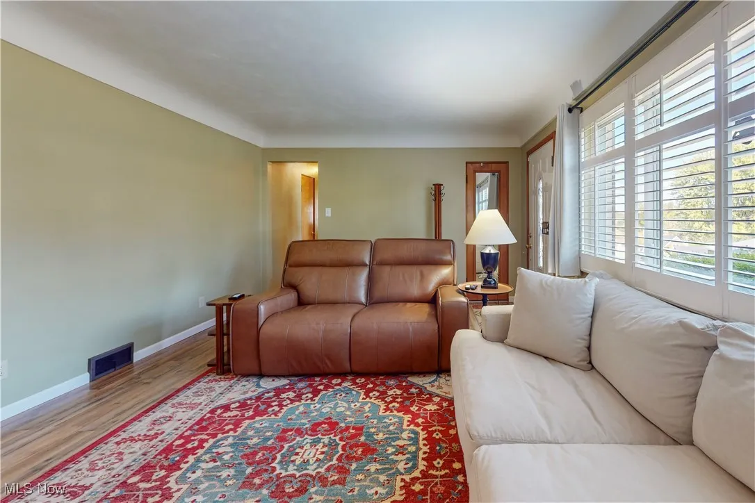 Living room featuring baseboards and wood finished floors