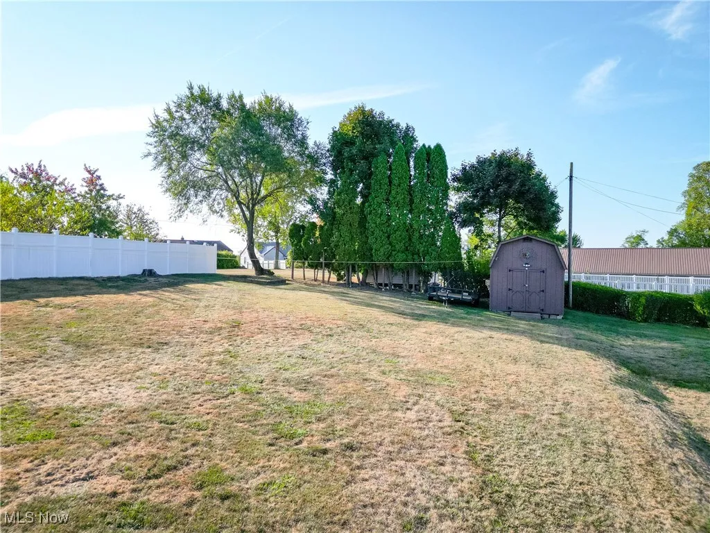 View of yard with a shed