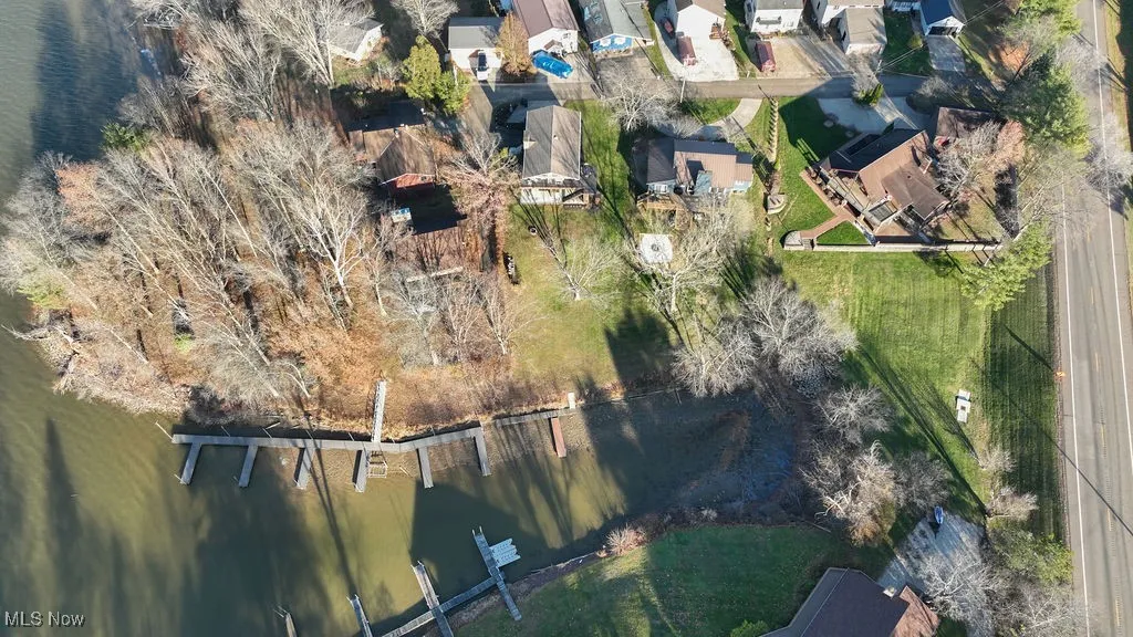 Aerial view of home with waterfront