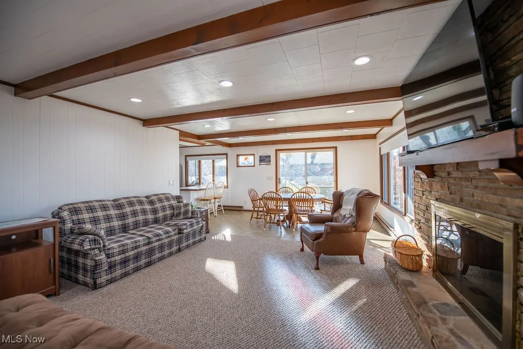 View of living room area with gas fireplace