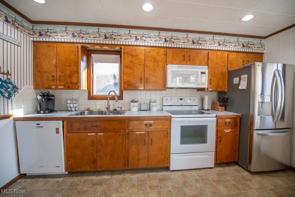 View of kitchen area with appliances