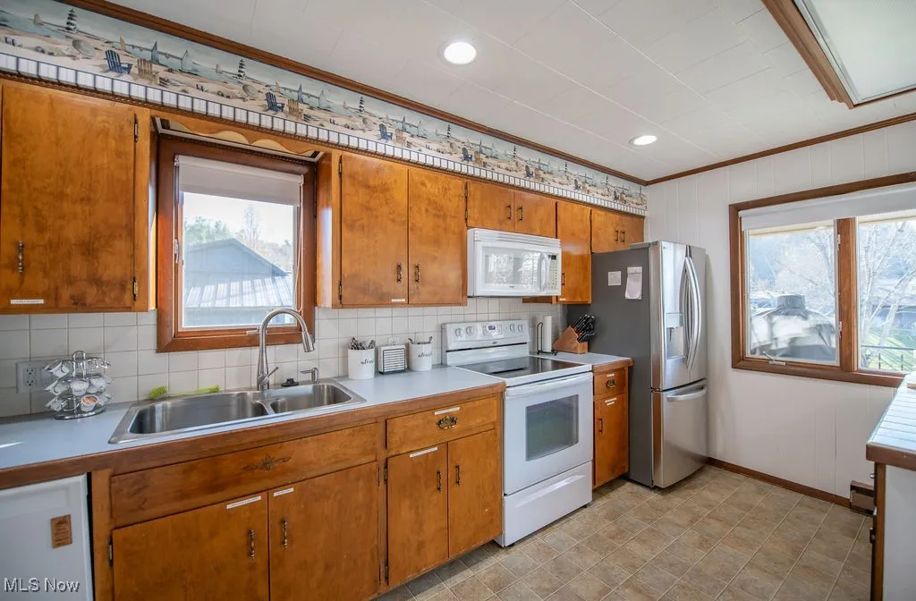 View of kitchen area with appliances