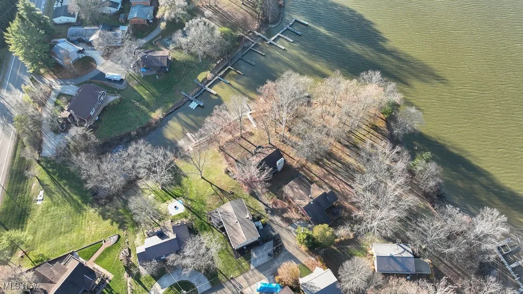 Aerial view of home with lake view