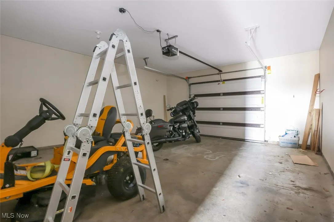 Garage featuring a garage door opener