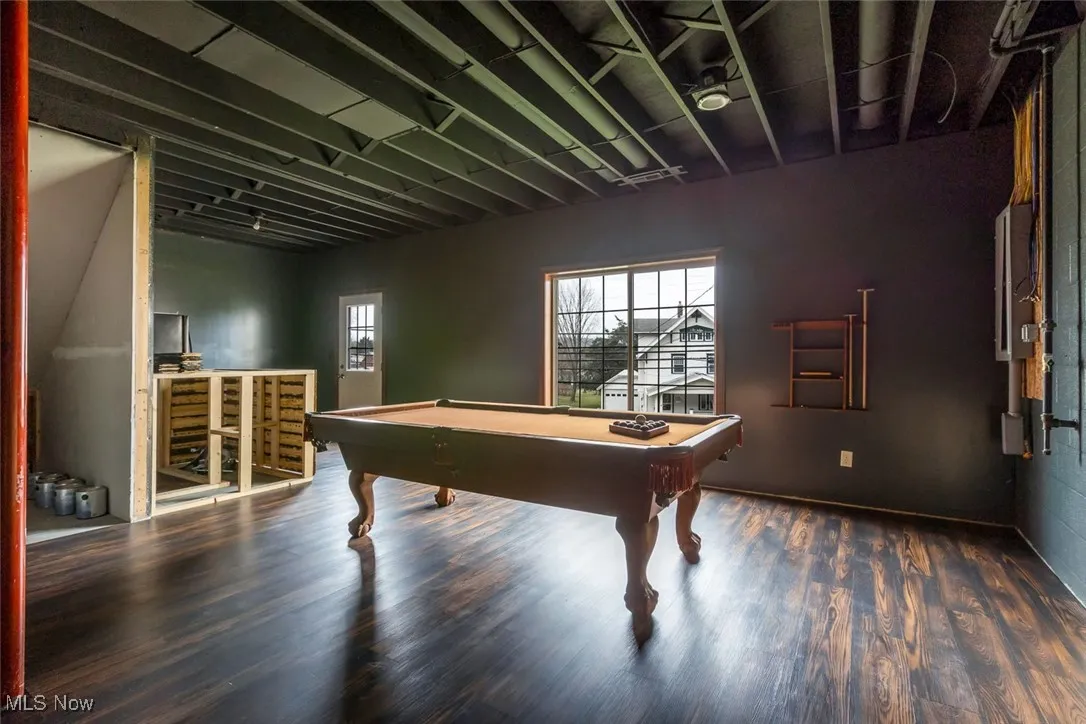 Game room with pool table and wood finished floors
