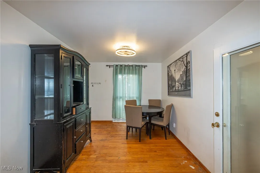 Dining space with light wood finished floors and baseboards