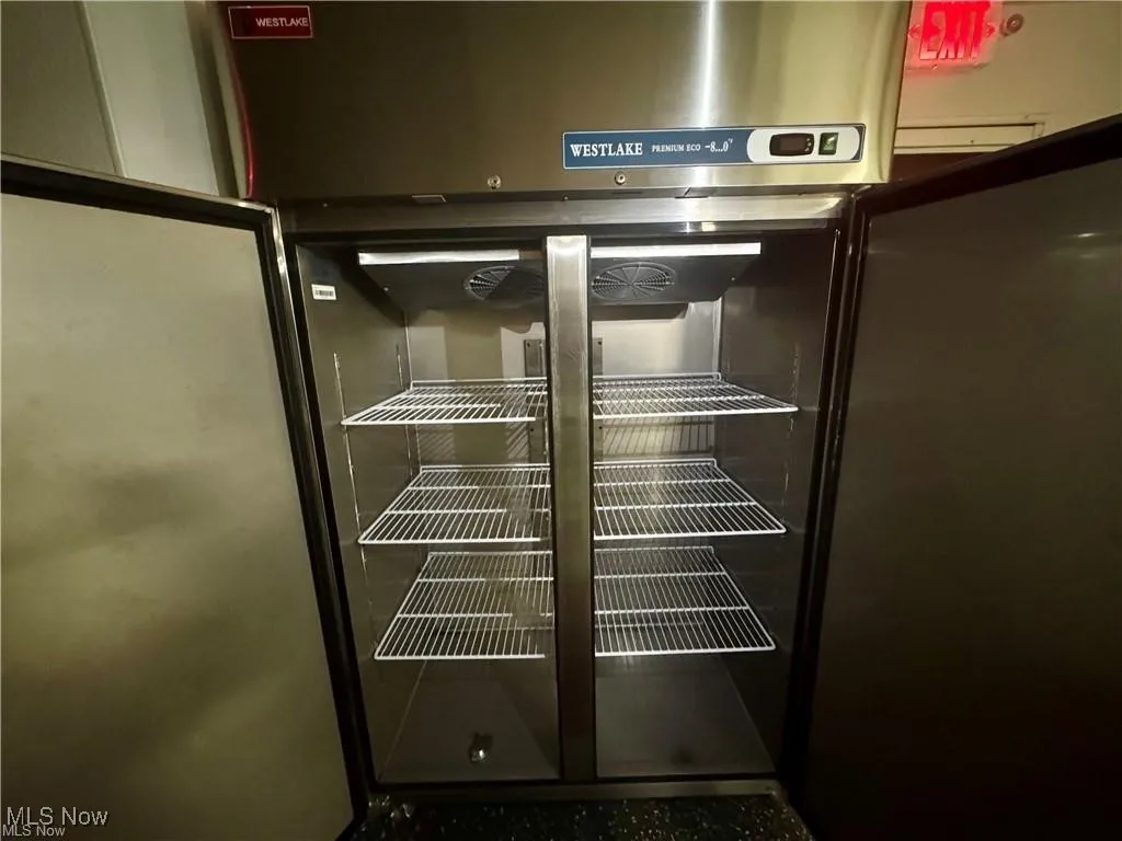 Kitchen view of stainless steel fridge